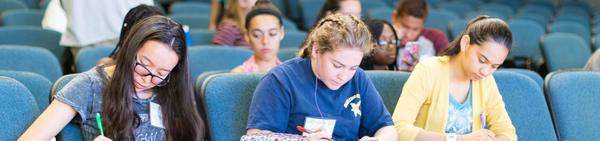 High school students take notes during an EAOP at UC Riverside event. 