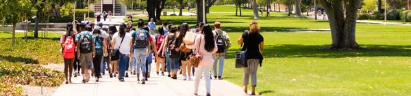 EAOP at UC Riverside participants walk toward the Bell Tower on the UCR campus.