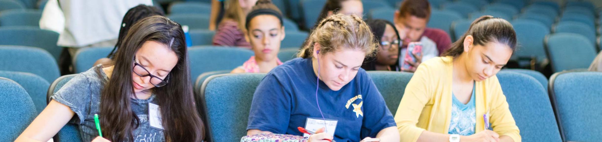 High school students take notes during an EAOP at UC Riverside event.